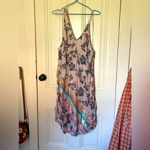 Free people sundress. Sequin details, side slits, asymmetrical straps. Size M